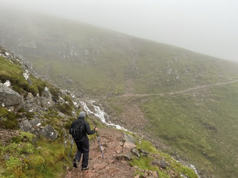 An Atmos colleague ascending one of the three peaks in foggy conditions