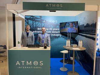 Sales and Senior Research Engineer Harry Smith and Business Development Director for water Martin Duff on an event stand at the International Water Association's (IWA) 2024 Water Loss event in San Sebastian