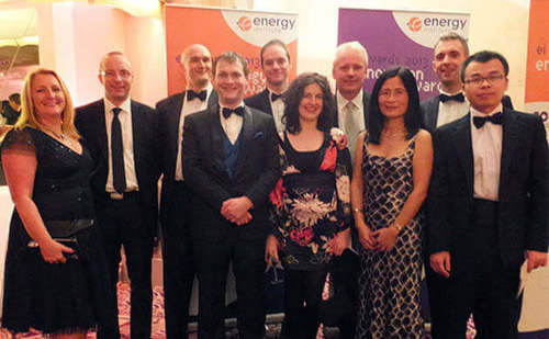 Photo of Dr. Jun Zhang with the Atmos International team at the EI Awards 2013