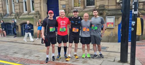 An image of Atmos colleagues after completing the AJ Bell Great Manchester Run