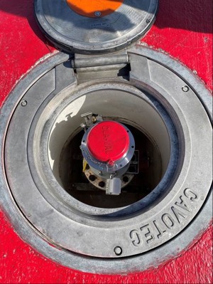 An open hydrant pit valve lid with Atmos Pit Sentry attached to the hydrant system