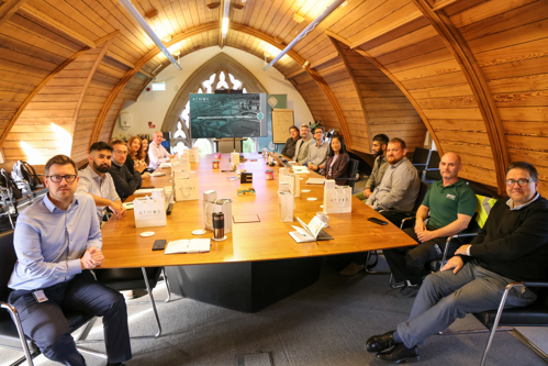 A group photo of Atmos International colleagues and United Utilities colleagues during their visit to Atmos' UK headquarters in Manchester