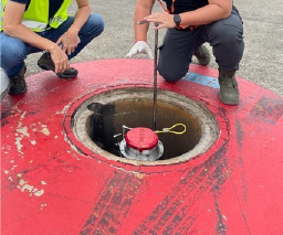 Operators performing a pit valve integrity test in the USA